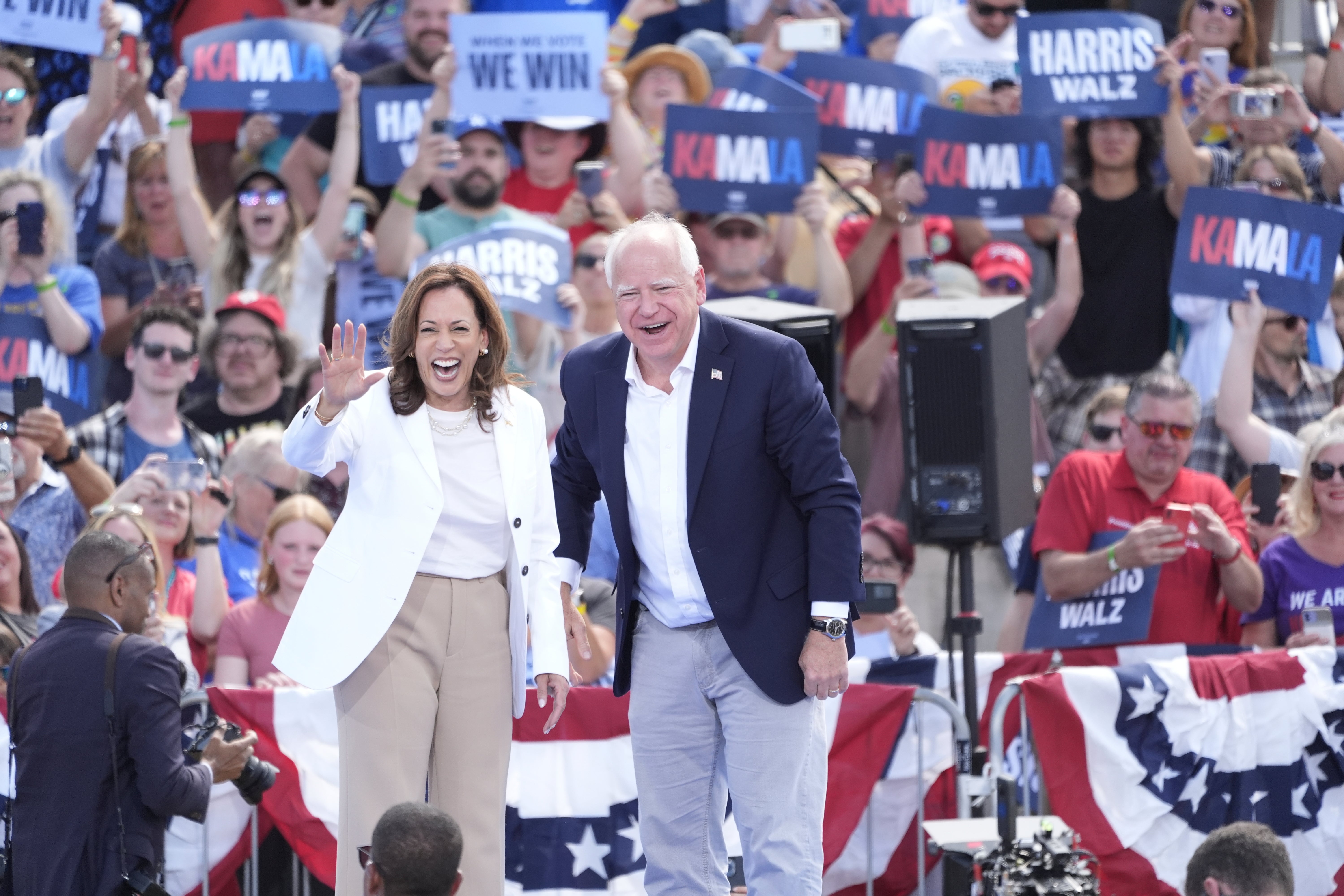 Democratic presidential nominee Vice President Kamala Harris is welcomed by Democratic vice presidential nominee Minnesota Gov. Tim Walz, before she delivers remarks at a campaign event, Wednesday, Aug. 7, 2024, in Eau Claire, Wisc.