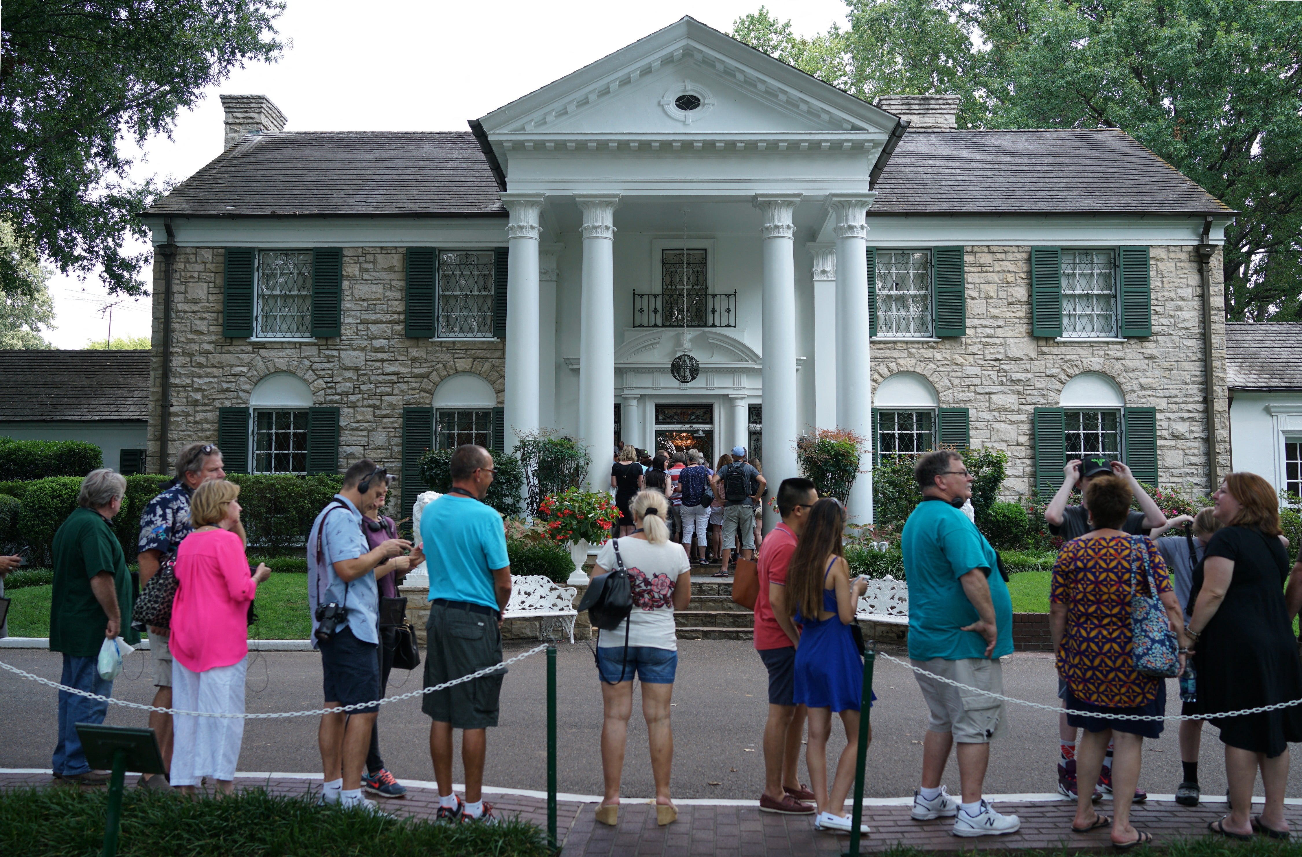 Visitors line up at Elvis Presley’s Graceland property. Officials have arrested the woman they believe is responsible for attempting to fraudulently sell the property earlier this year