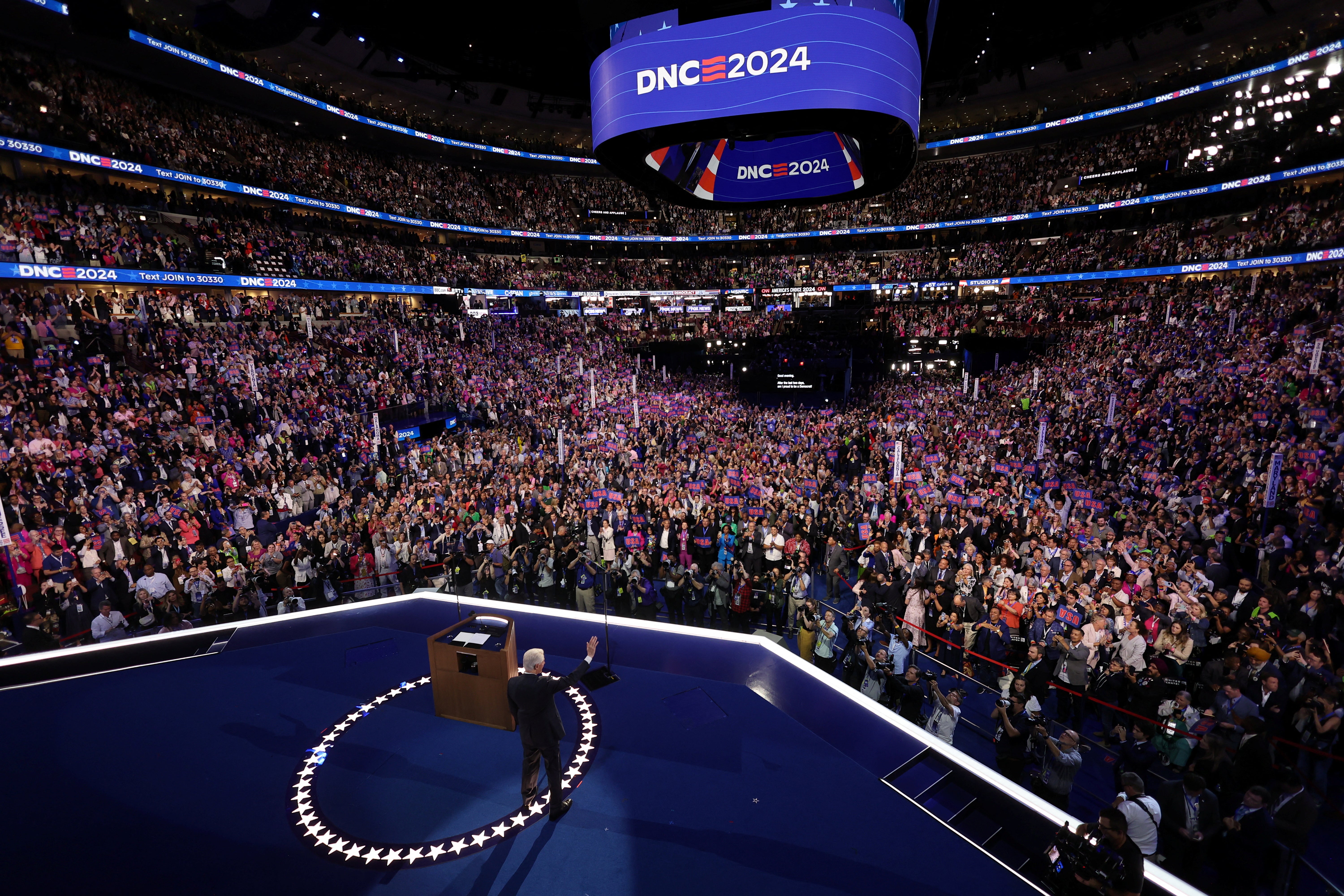 Former U.S. President Bill Clinton waves to the audience on Day 3 of the Democratic National Convention (DNC) in Chicago, Illinois, U.S., August 21, 2024