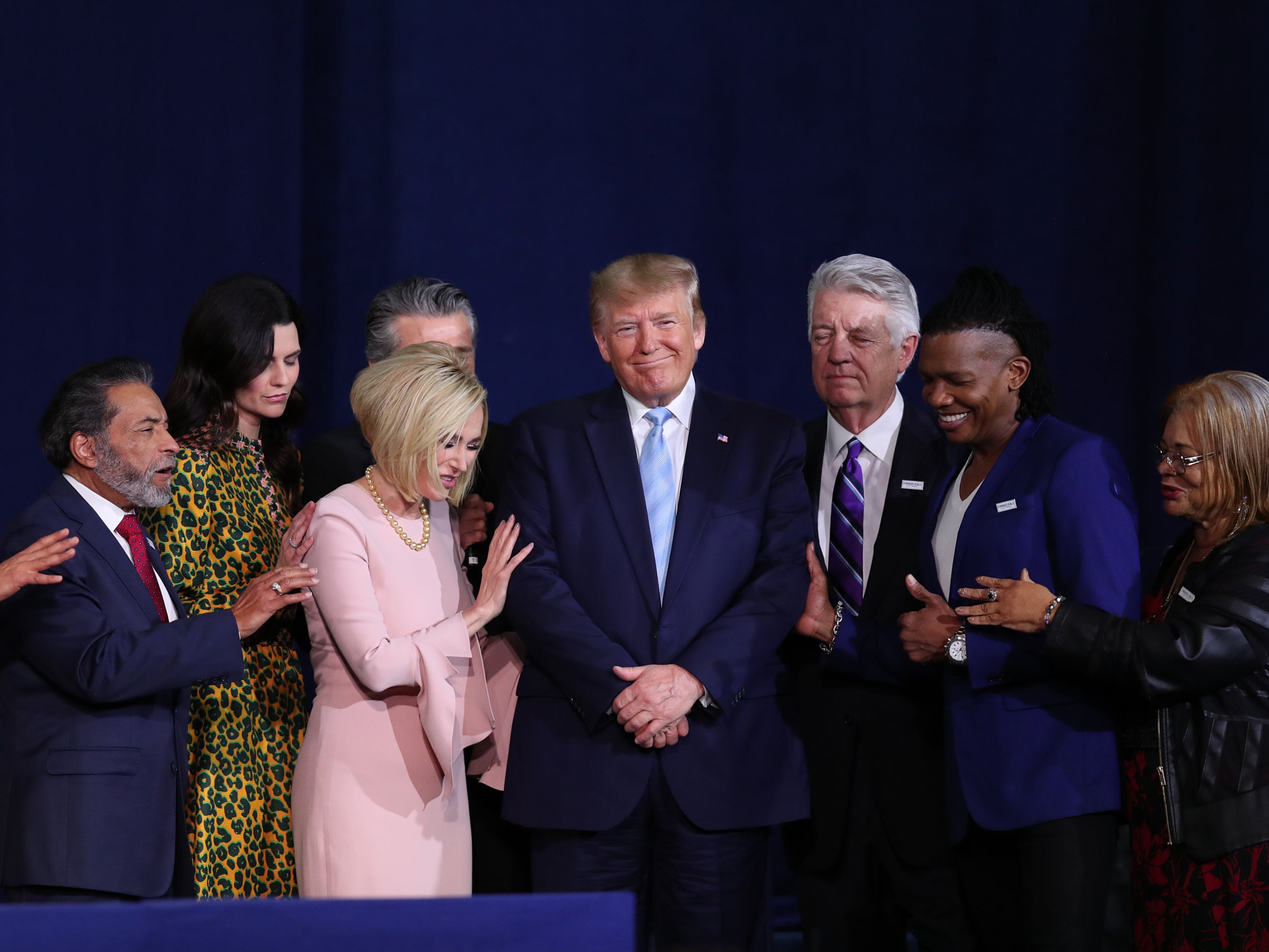 Faith leaders pray over the former president during an 'Evangelicals for Trump' campaign event in 2020