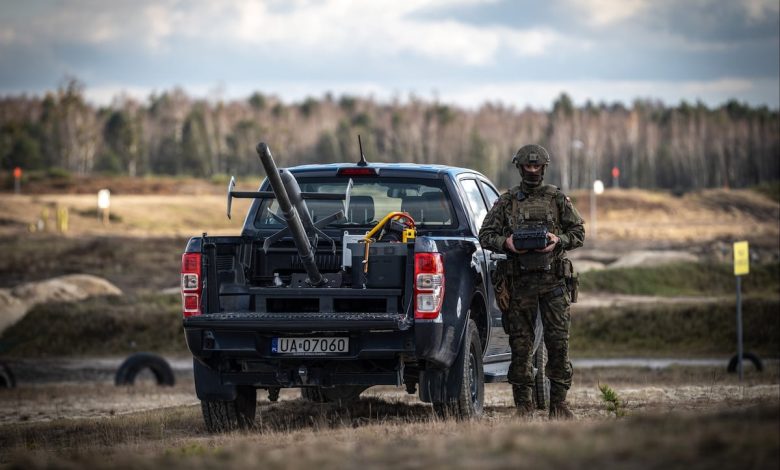 US and NATO troops practice drone-on-drone combat using a pickup truck US and NATO troops practice drone-on-drone combat using a pickup truck