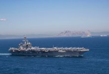 Iran puts ‘fingers on trigger’ as US armada arrives in Middle East