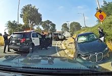 Suspect Shot After Slamming BMW Into Police Cruisers And Aiming Gun