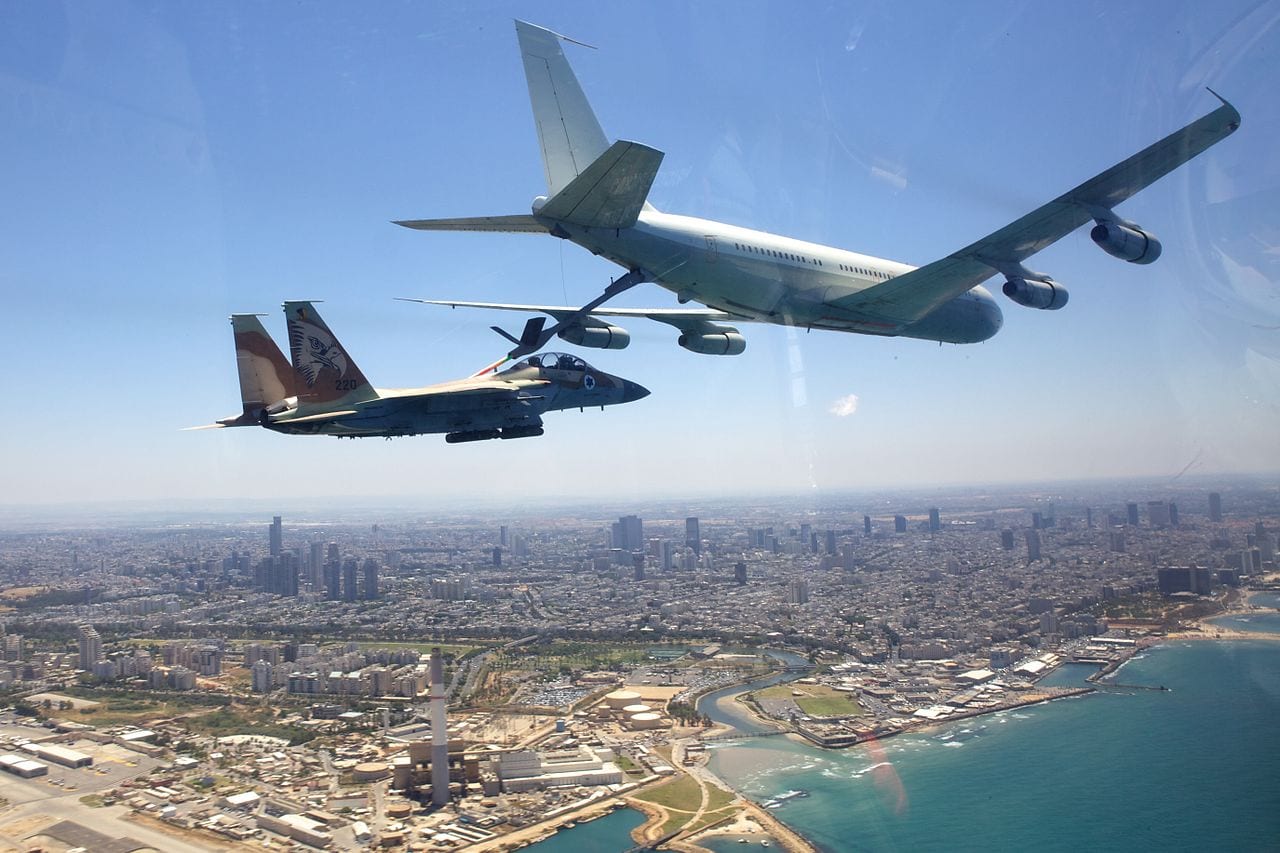 May 10, 2011. The Israeli Air Force crosses all of Israel from north to south, in honor of the country's 63rd Independence Day. Pictured: A "Re'em" plane (Boeing 707) refueling a "Ra'am" plane (F-15I) above the beaches of Tel-Aviv. Image: Creative Commons.