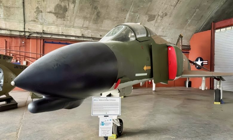A Fully Loaded with Bombs US Air Force F-4 Phantom Fighter Rolled Upside Down Underneath a Tanker at Night in a Thunderstorm To Get Separation