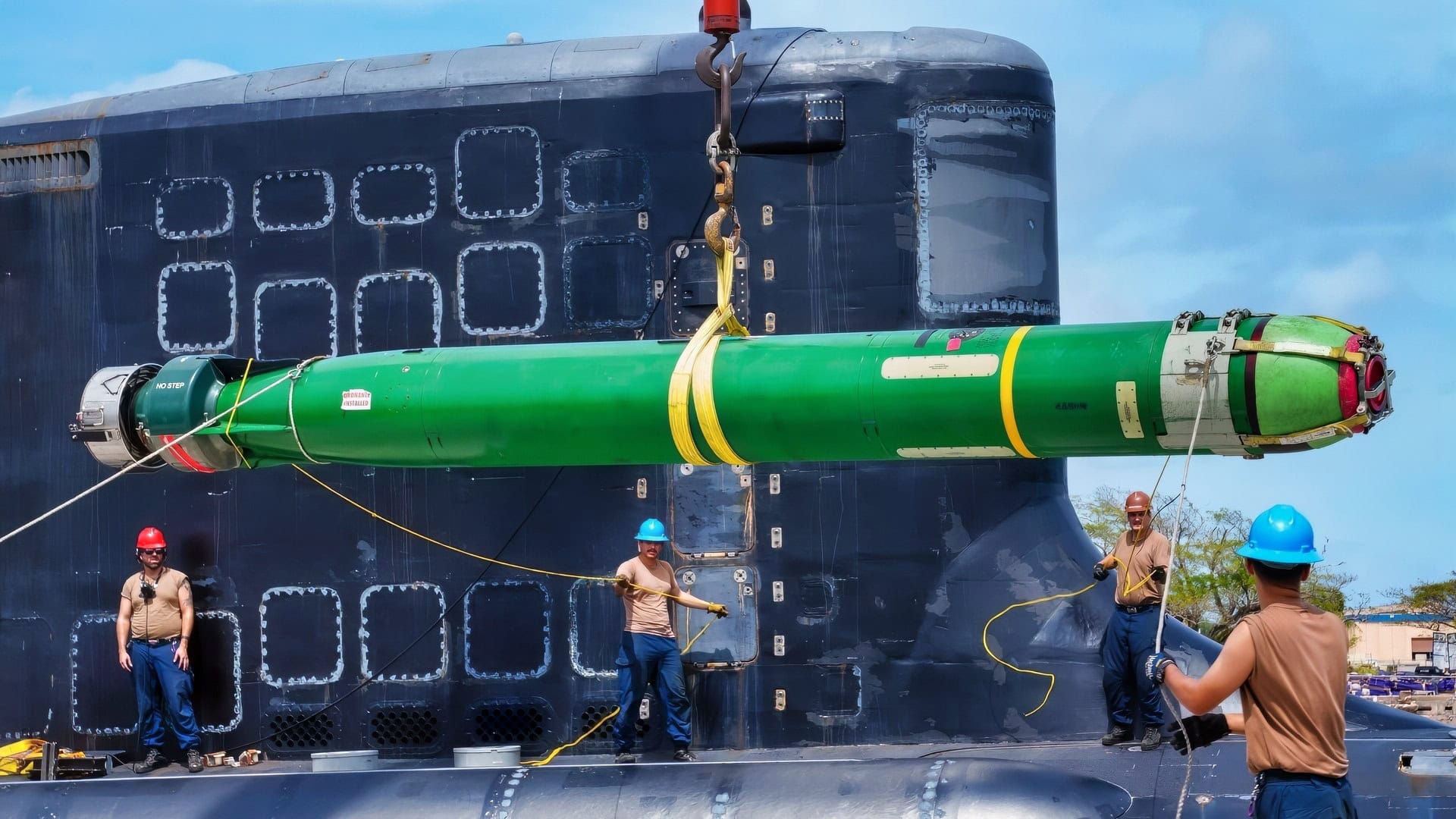 NAVAL BASE GUAM (Feb. 3, 2025) – Sailors assigned to the Virginia-class fast-attack submarine USS Minnesota (SSN 783) guide a Mark 48 ADCAP (Advanced Capability) torpedo during a weapons offload onboard Naval Base Guam, Feb. 3, 2025. Assigned to Commander, Submarine Squadron 15, based at Polaris Point, Naval Base Guam, Minnesota is one of five forward-deployed fast-attack submarines. Renowned for their unparalleled speed, endurance, stealth, and mobility, fast-attack submarines are the backbone of the Navy’s submarine force. Regarded as apex predators of the sea, Guam’s fast-attack submarines serve at the tip of the spear, helping to reaffirm the submarine force's forward-deployed presence in support of a free and open Indo-Pacific. (U.S. Navy photo by Mass Communication Specialist 1st Class Nikita Custer)