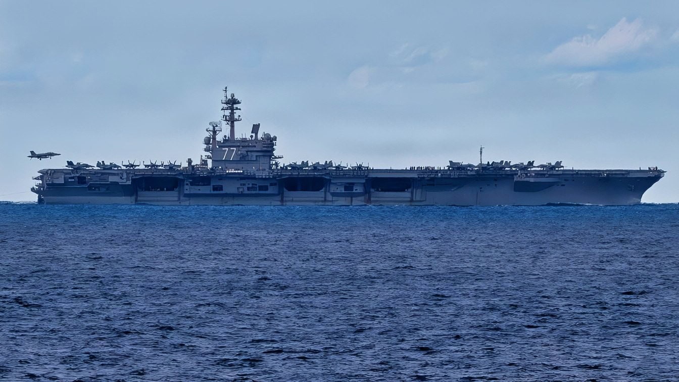 The Nimitz-class aircraft carrier USS George H.W. Bush (CVN 77) sails in the Atlantic Ocean, Feb. 14, 2026. The George H.W. Bush Carrier Strike Group is at sea training as an integrated warfighting team. Composite Training Unit Exercise (COMPTUEX) is the Joint Force's most complex integrated training event and prepares naval task forces for sustained high-end Joint and combined combat. Integrated naval training provides combatant commanders and America's civilian leaders highly capable forces that deter adversaries, underpin American security and economic prosperity, and reassure Allies and partners. (U.S. Navy photo by Mass Communication Specialist 3rd Class Mark Peña)