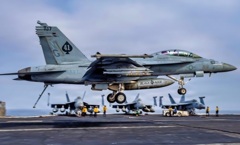 USS Abraham Lincoln is 305 days into a cruise that is now the second-longest U.S. aircraft carrier deployment since the Cold War and after Iran combat, 208 days straight at sea, and a one-day stop at Naval Base Guam the strike group is still weeks from San Diego
